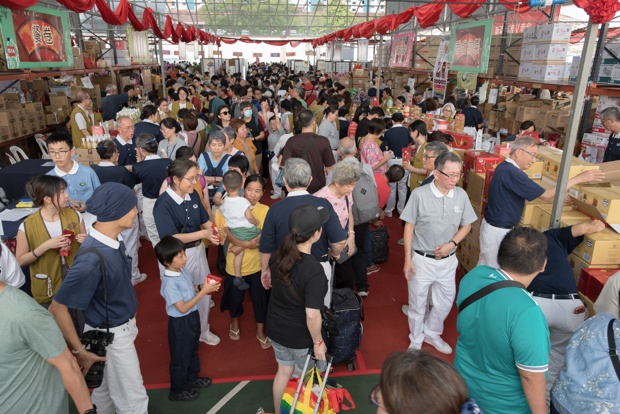 The CNY goods section is filled with festive cheer, creating a lively atmosphere while spreading the spirit of giving. (Photo by Goh Shoo Weng) 